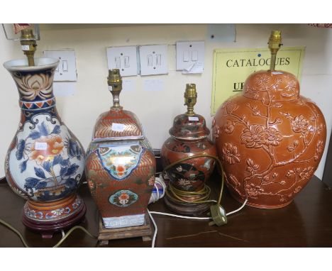 A lot comprising four assorted ceramic table lamps and modern wood framed wall mirror (5) Condition Report: Table is in good 