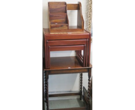 A 20th century teak nest of three table with tile tops, an oak occasion table with barley twist supports and a hardwood stati