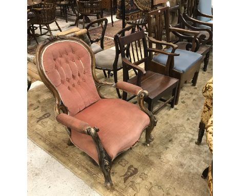 A collection of chairs comprising two 19th Century panel-seated elbow chairs, a provincial Chippendale style commode chair (i