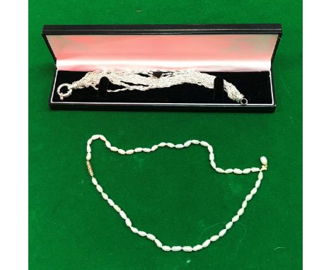 A freshwater pearl necklace with clover leaf and pearl pendant set with three small diamonds, together with a Milor of Italy 