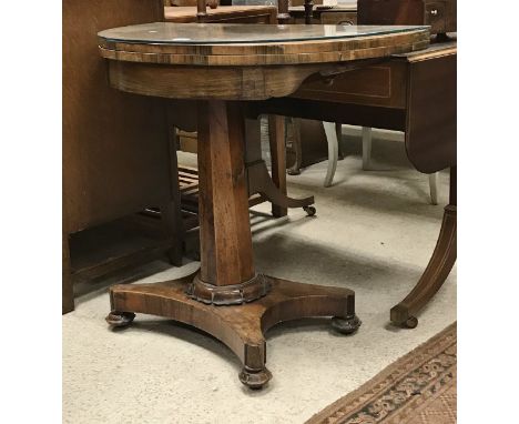 A Victorian rosewood pedestal card table of demi-lune form on a quadruped platform base