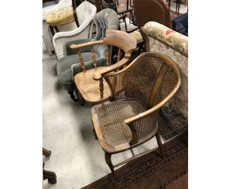 A Victorian button back tub chair with blue velvet upholstery, scroll arms and ringed and turned front legs together with an 