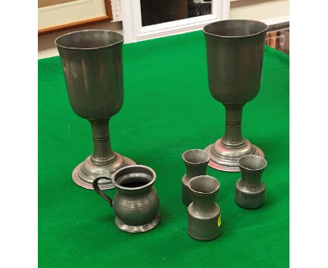 A collection of mainly 19th Century pewter wares, to include a pair of stemmed goblets, various baluster-shaped imperial meau