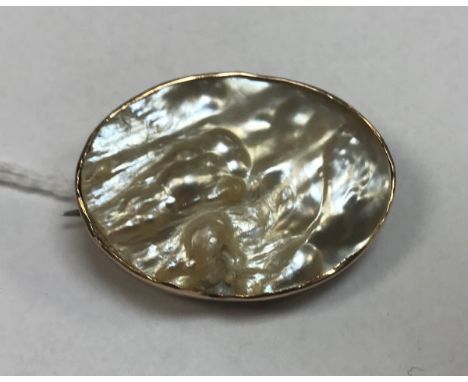 A nine carat gold set blister pearl brooch, the mount inscribed "March 7th 1918"