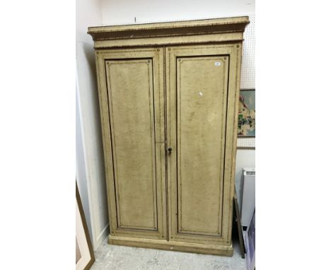 A Victorian painted pine double wardrobe in simulated bird's eye maple, the two cupboard doors opening to reveal a hanging sp