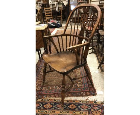 A set of four modern ash and oak Thames Valley style stick-back chairs on turned legs united by crinoline stretchers