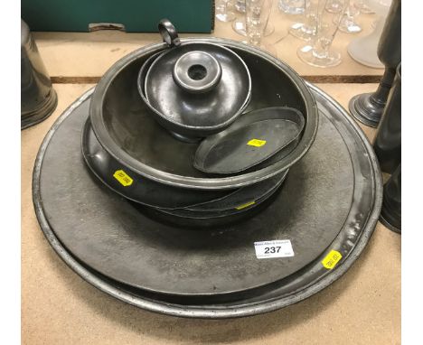 A collection of various 18th and 19th Century pewter wares, to include two chargers, three various plates, two circular bowle