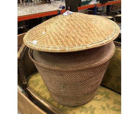 A cane work lidded basket together with three caned hats of small proportion and a larger hat, together with an Imperial type