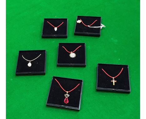 Six various nine carat gold mounted pendants each with various stone, pearl etc decoration