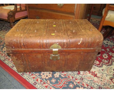 A VINTAGE TIN TRUNK