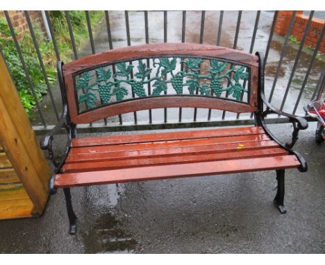 A METAL / CAST GARDEN BENCH
