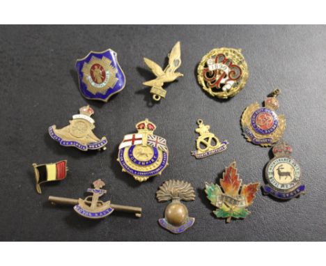 A QUANTITY OF MILITARY VINTAGE ENAMEL BADGES