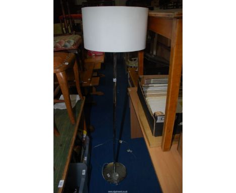 A standard lamp with shade.