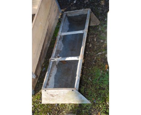 A galvanised animal trough, 3' x 11".