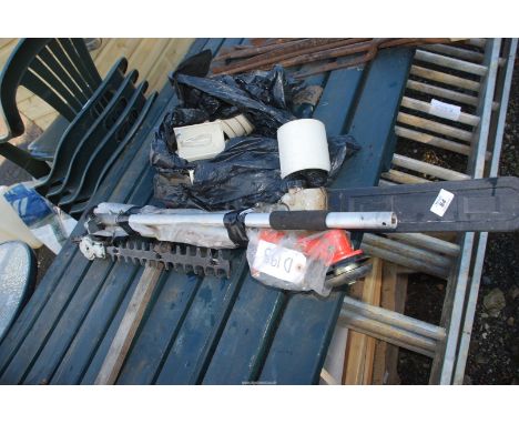 A hedge trimmer and chainsaw attachments and lamp shades.