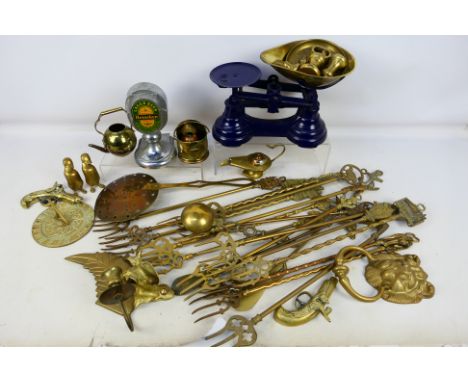 A box of metalware, predominantly brass to include fireside items, sundial and other. [W]

PLEASE NOTE: ALL LOTS NEED TO BE C