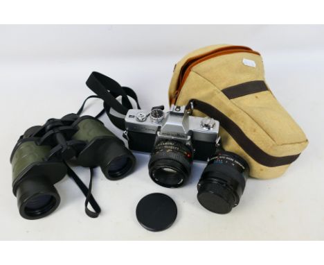 Minolta - Hilkinson - An Minolta SRT100x film camera with additional Panagor lense. Housed is a zip lock bag. Item would bene