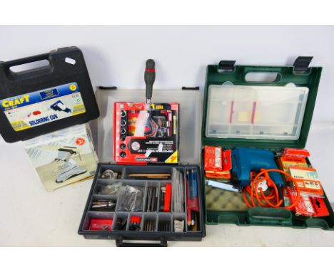A collection of tools to include boxed vacuum vice, soldering gun, staple gun, socket set and other. [W]

PLEASE NOTE: ALL LO
