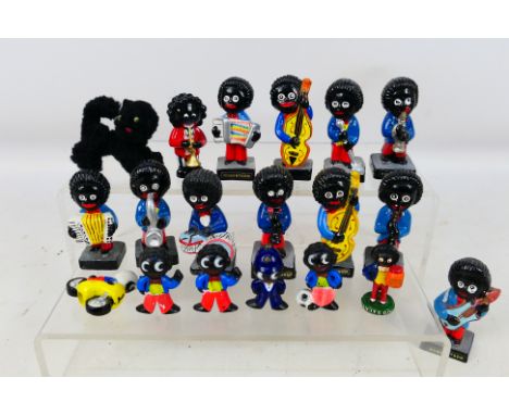 A collection of Robertson's and similar advertising figures to include band figures, pencil toppers and hand painted metal fi
