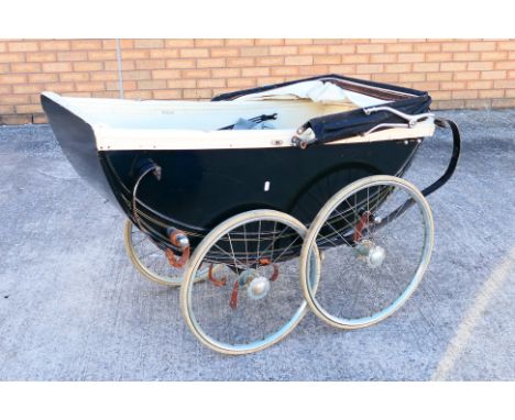 A vintage Marmet style pram with canopy and some accessories. Overall the pram appears to be in Poor condition. The pram is u