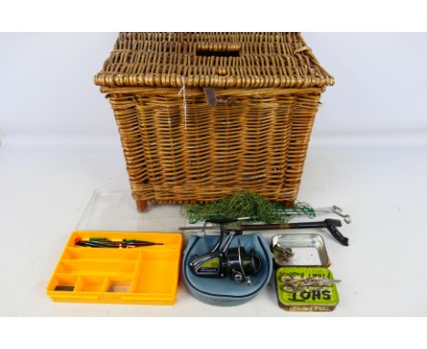 A vintage wicker fishing basket with angling equipment including a reel. [W]

PLEASE NOTE: ALL LOTS NEED TO BE COLLECTED OR D