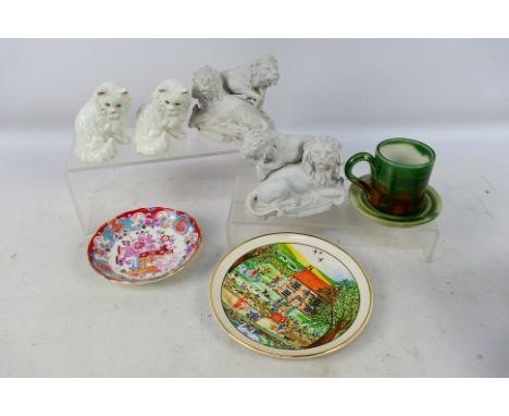 A small group of ceramics to include a pair of Goebel cat figures, model CK13, 8 cm (h), two parian lion groups and other. [W
