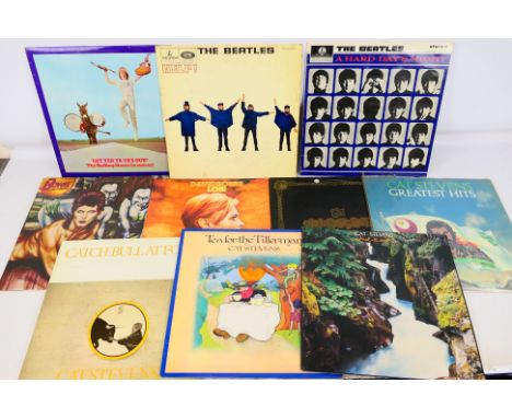A collection of 12" vinyl records to include The Beatles, David Bowie, Cat Stevens, The Rolling Stones and other. [W]

Condit