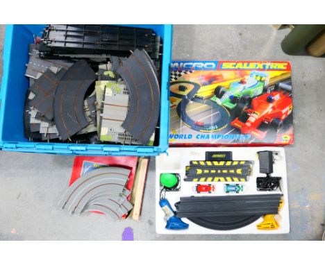 Micro Scalextric - Tri-ang - A Boxed 1/64 scale Mircro Scalextric #G094 World Championship. items appears to e in very good c