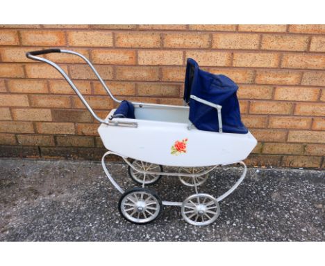 Leeway - A vintage Leeway children's toy pram. The pram has age and play wear appearing to be in Fair condition overall. The 
