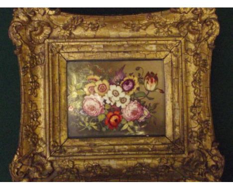 Hand painted floral tile set in a gilt swept frame , possibly Minton , tile 10 cm x 14 cm . frame 22 cm x 26 cm