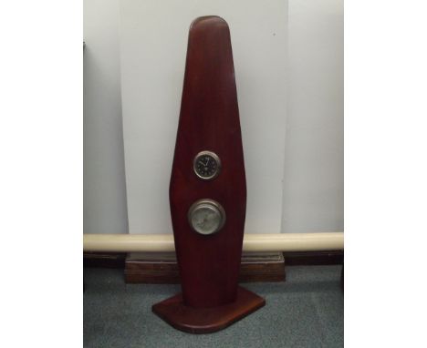 Laminated part aeroplane propeller inset with a Smiths clock above an aneroid barometer, fixed to a mahogany plinth (cracked 