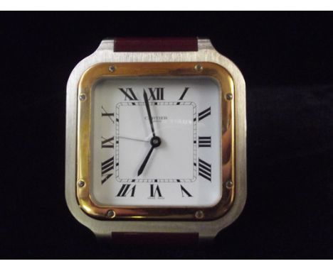 A Cartier Santos Lacquered alarm travel/mantle clock 9cm high, in the form of a Cartier Tank watch. 7508 05927 with original 