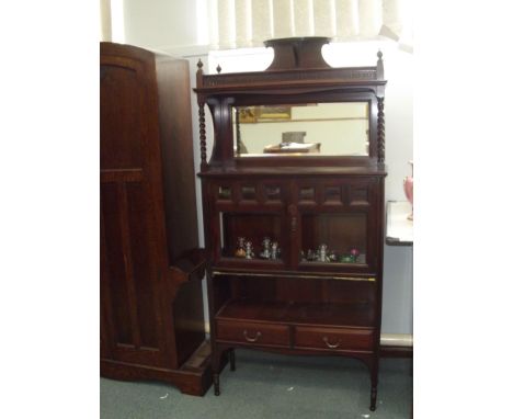 Quality mohogany late Victorian/Edwardian display cabinet with bevelled mirror and glazed doors . Greek key fret to upper she