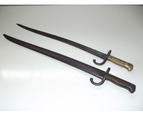 Two late 19th century chassepot bayonets one complete with scabbard with correlating serial number. blade length 57.5cm