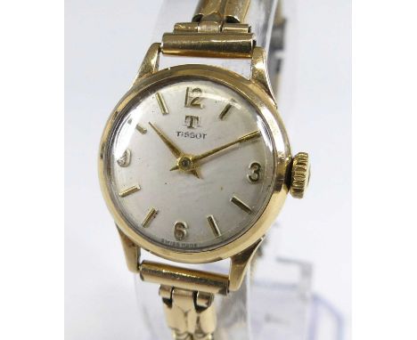 A Tissot lady's vintage 9ct gold cased manual wind wristwatch, having signed champagne dial with quarter Arabic numerals, cas