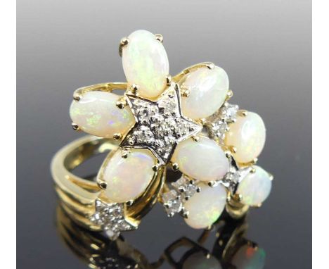 A modern 14ct gold opal and diamond set dress ring, arranged as two flower heads each set with four opal cabochons, each meas