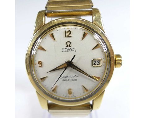 An Omega gent's Seamaster automatic calendar gold plated bracelet watch, having a signed silvered dial with quarter Arabic nu