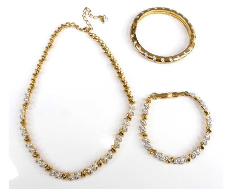 A Swarovski gilt metal crystal set hinge bangle together with a Swarovski gilt metal crystal set necklace and bracelet (3)