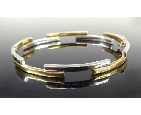 A contemporary 9ct yellow and white gold hinge bangle, arranged as hollow rectangular sections, 6.5cm, 8.7gInterior of the cl
