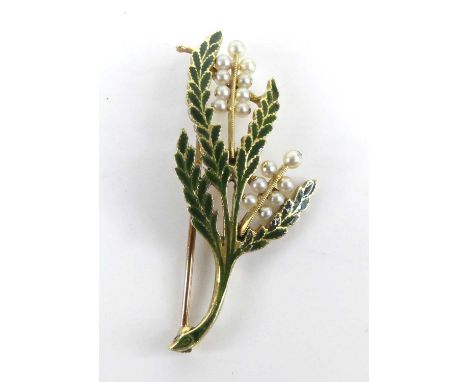 A yellow metal pearl brooch designed as a sprig of heather, with green enamel detail to the leaves and fifteen 2.55 to 2.7mm 