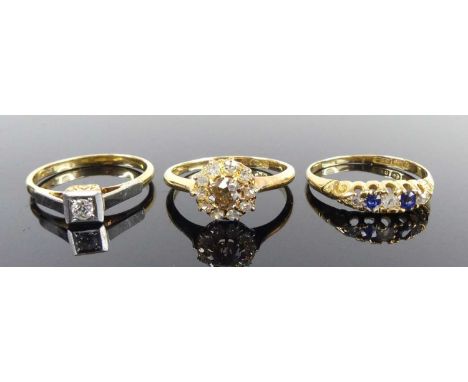 Three rings, comprising an 18ct yellow gold diamond circular cluster featuring a centre fancy light brown round diamond withi