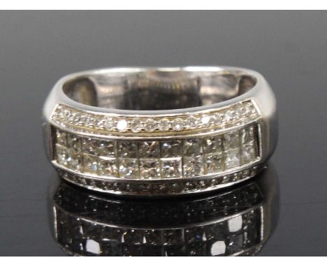 A white metal diamond four-row half eternity ring, featuring two rows each with eleven Princess cut diamonds in calibre setti