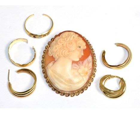 A carved shell cameo brooch, in a 9 carat gold rope frame, measures 5.2cm by 4.5cm; a pair of tri-colour hoop earrings (af, o