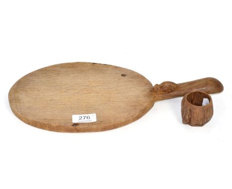 A Robert Mouseman Thompson English oak cheese board, with carved mouse signature; and a Robert Mouseman Thompson napkin ring 