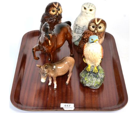 A Beswick horse, a Beswick donkey and four Royal Doulton Scotch Whisky ceramic birds including three owls 