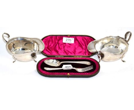A Georgian style silver sauceboat, T & S, Sheffield, 1935; another S. Ltd, Birmingham, 1965; with a cased late Victorian silv