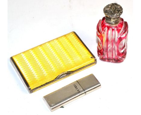 A silver and yellow enamelled lady's cigarette case with import marks, a silver lighter and a silver topped ruby flash glass 