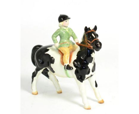 Beswick Girl on Pony, model No. 1499, Piebald glossIn good condition.  Beswick Crest backstamp to base. 