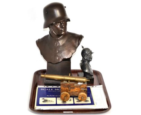 A plaster bust of First World War soldier; a model canon; and a metal bust (3)