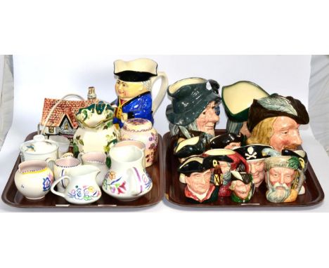 A quantity of Royal Doulton character jugs, Poole ware jugs etc 